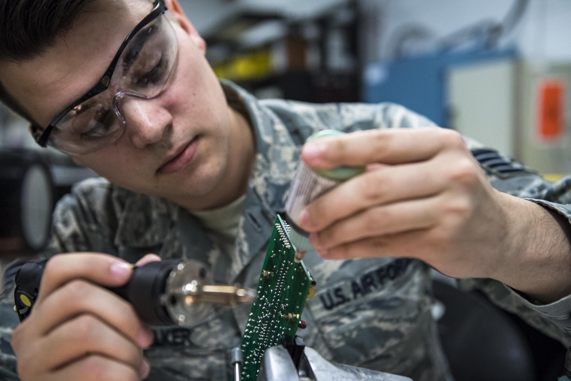 Staff Sgt. Cody Voelker, 23d Maintenance Group Air Force Repair Enhancement Program technician, solders components to a circuit board, Jan. 30, 2017, at Moody Air Force Base, Ga. The AFREP’s mission is to diagnose problems and repair equipment other units cannot fix. (U.S. Air Force photo by Airman 1st Class Janiqua P. Robinson)