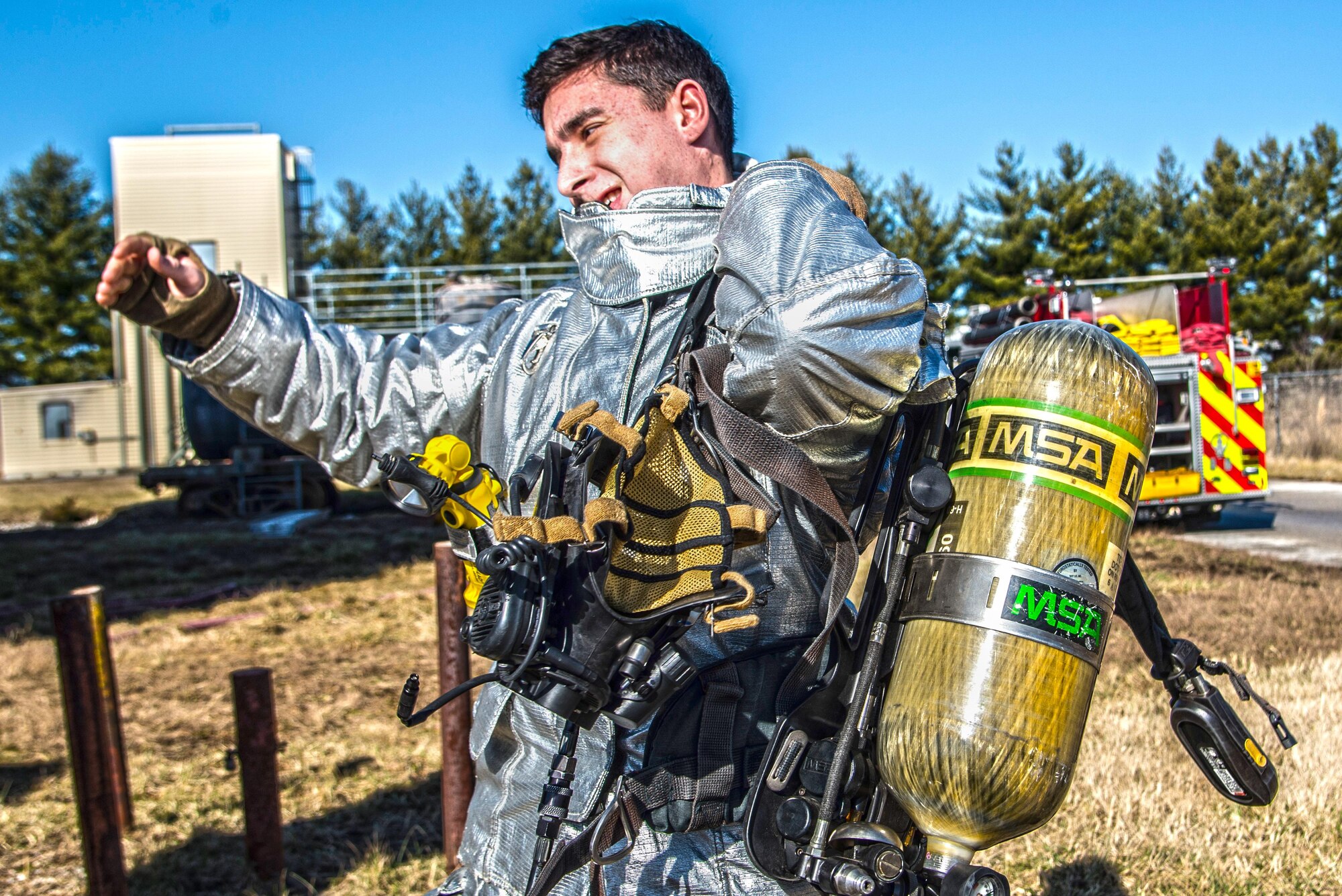 Firefighters with the 375th Civil Engineer Squadron perform drills during a timed test at Scott on Jan. 21. The test explored standards and applied principles of the standards as participants were timed on dragging the hose, putting their gear on and hoisting a hatchet among other smaller drills. Firefighters deal with everything from brush fires to burning rocket fuel and hazardous material fires. Throughout the year the firefighters train on fire suppression, aviation fire suppression, hazardous materials, emergency medical services, technical rescue, fire prevention and public education, as well as adequate standard operating guides, effective program management of additional duties and a comprehensive career training program.
