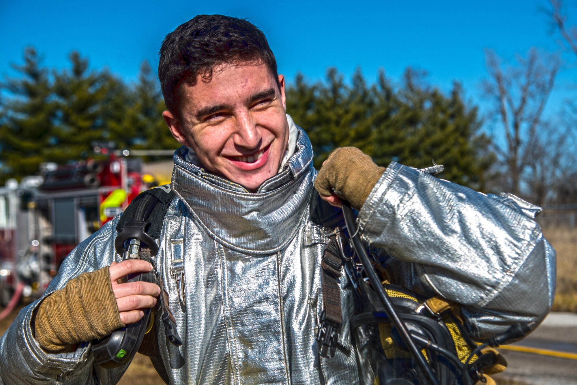 Firefighters with the 375th Civil Engineer Squadron perform drills during a timed test at Scott on Jan. 21. The test explored standards and applied principles of the standards as participants were timed on dragging the hose, putting their gear on and hoisting a hatchet among other smaller drills. Firefighters deal with everything from brush fires to burning rocket fuel and hazardous material fires. Throughout the year the firefighters train on fire suppression, aviation fire suppression, hazardous materials, emergency medical services, technical rescue, fire prevention and public education, as well as adequate standard operating guides, effective program management of additional duties and a comprehensive career training program.