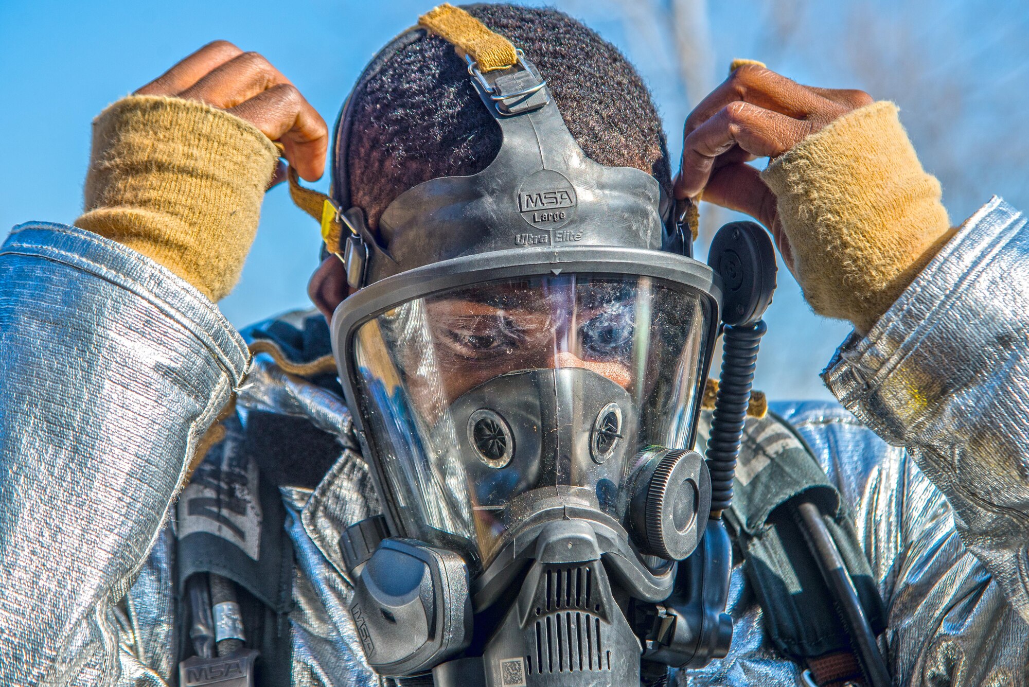 Firefighters with the 375th Civil Engineer Squadron perform drills during a timed test at Scott on Jan. 21. The test explored standards and applied principles of the standards as participants were timed on dragging the hose, putting their gear on and hoisting a hatchet among other smaller drills. Firefighters deal with everything from brush fires to burning rocket fuel and hazardous material fires. Throughout the year the firefighters train on fire suppression, aviation fire suppression, hazardous materials, emergency medical services, technical rescue, fire prevention and public education, as well as adequate standard operating guides, effective program management of additional duties and a comprehensive career training program.