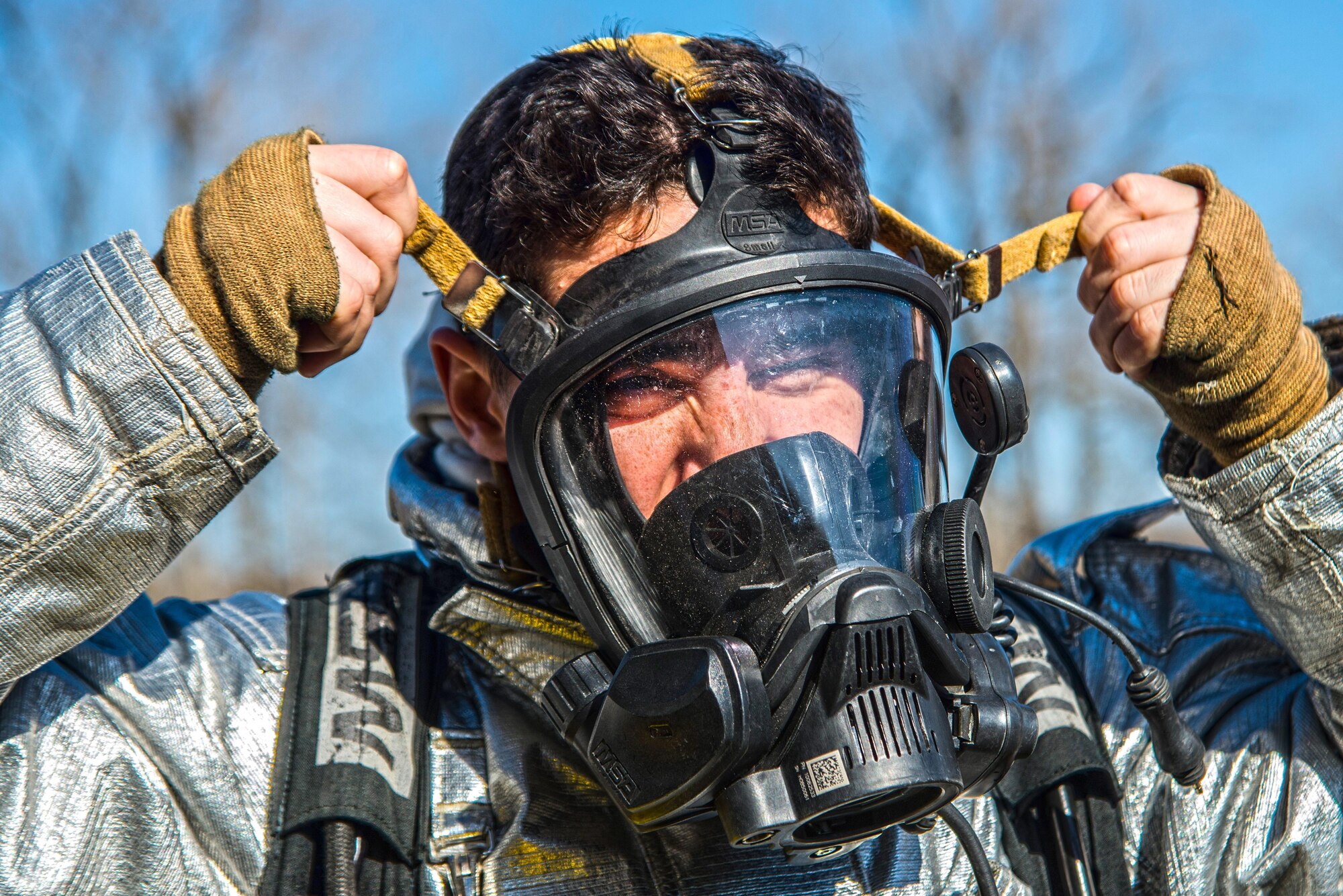 Firefighters with the 375th Civil Engineer Squadron perform drills during a timed test at Scott on Jan. 21. The test explored standards and applied principles of the standards as participants were timed on dragging the hose, putting their gear on and hoisting a hatchet among other smaller drills. Firefighters deal with everything from brush fires to burning rocket fuel and hazardous material fires. Throughout the year the firefighters train on fire suppression, aviation fire suppression, hazardous materials, emergency medical services, technical rescue, fire prevention and public education, as well as adequate standard operating guides, effective program management of additional duties and a comprehensive career training program.