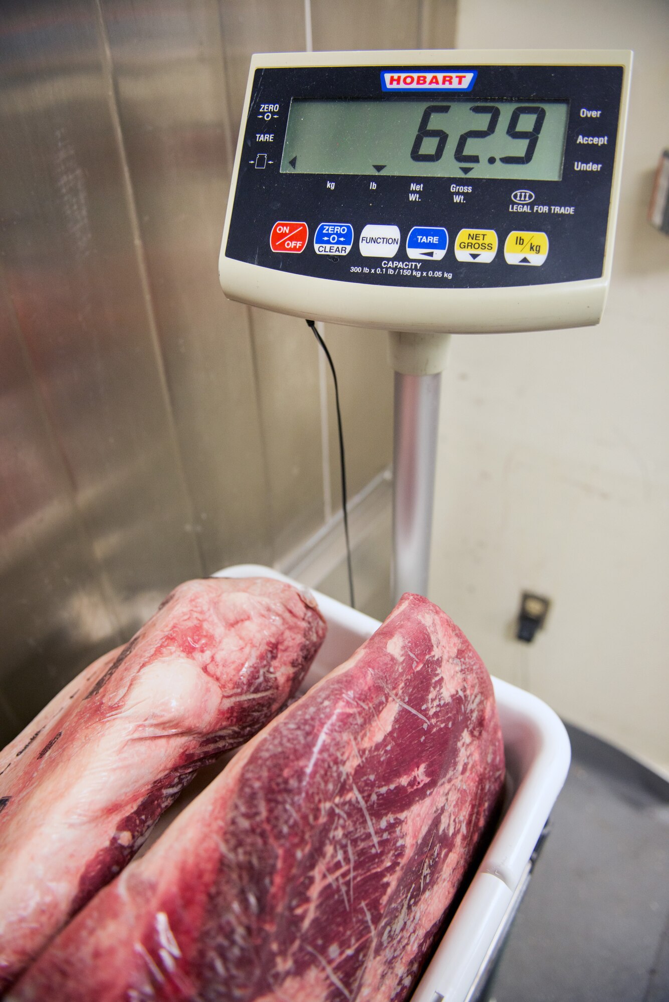 Meat is weighed at the Sierra Inn Dining Facility at Travis Air Force Base, Calif., Jan. 25, 2017. The dining facility was named Air Mobility Command's best and will now compete at the Air Force level for the John L. Hennessy Trophy, which recognizes excellence in food service. (U.S. Air Force photo/Louis Briscese)