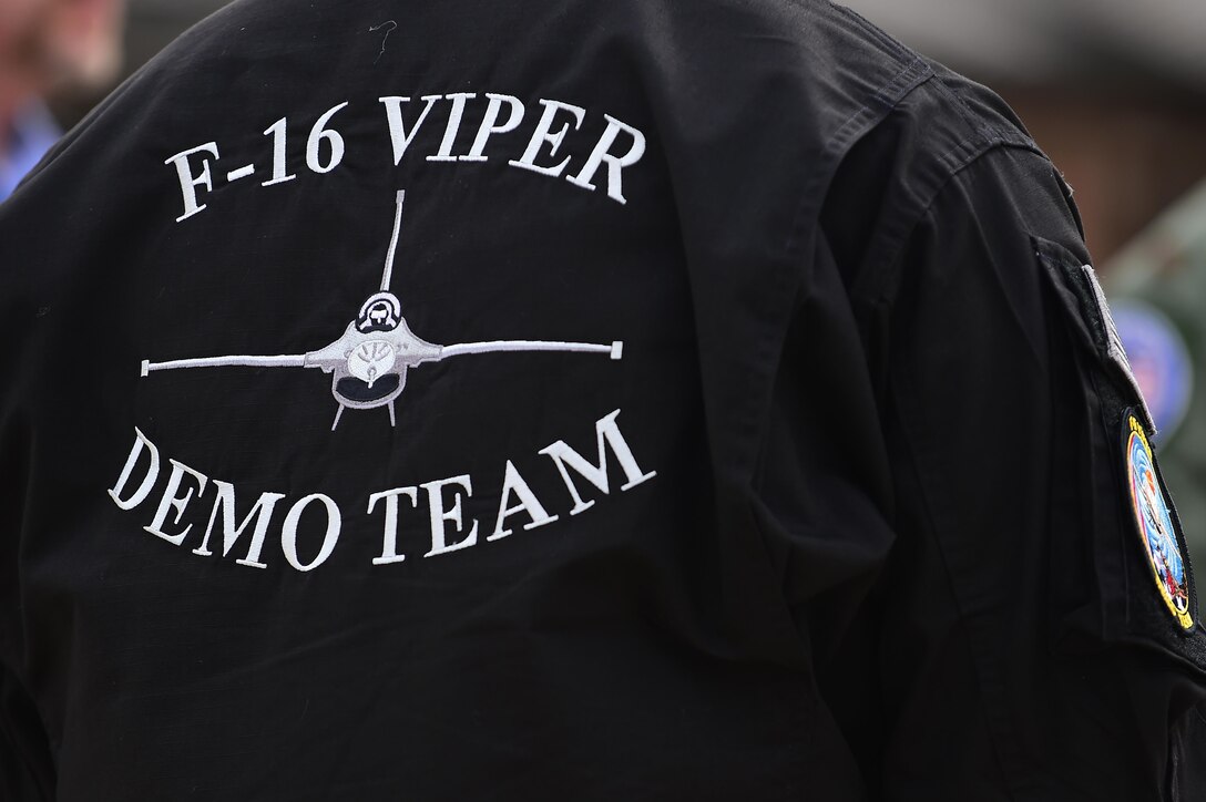 A member of the F-16 Viper Demonstration Team assists with the after flight checks at Joint Base Langley-Eustis, Va., Jan. 31, 2017. Members of the team travel with the demo team pilots on their missions to ensure the aircraft and other mechanical aspects are up to par at all times. (U.S. Air Force photo by Senior Airman Kimberly Nagle)