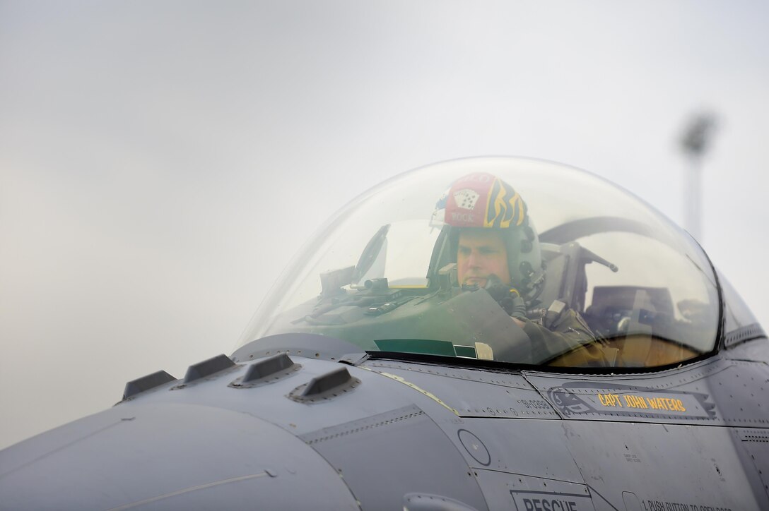 U.S. Air Force Capt. John Waters, F-16 Viper Demonstration Team pilot, taxis on the runway at Joint Base Langley-Eustis, Va., Jan. 31, 2017. Waters and his team arrived at JBLE so he could complete a Commander of the Air Combat Command certification training, securing him a spot as a pilot for the team. (U.S. Air Force photo by Senior Airman Kimberly Nagle)