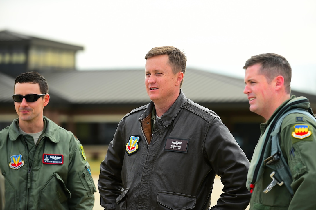 From left, U.S. Air Force Maj. Daniel Dickinson, F-22 Raptor Demonstration Team commander, U.S. Air Force Lt. Col. Christopher McAlear, Air Combat Command chief of aerial events, and U.S. Air Force Capt. John Waters, F-16 Viper Demonstration Team pilot, meet after the F-16 Vipers landed at Joint Base Langley-Eustis, Va., Jan. 31, 2017. Waters traveled to JBLE with is team to complete a Commander of the Air Combat Command certification, ensuring he is capable of flying with the demo team. (U.S. Air Force photo by Senior Airman Kimberly Nagle ) 