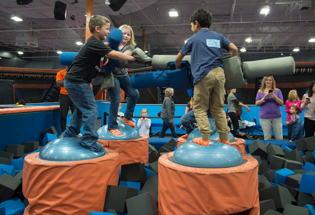 Children compete in a gladiator competition during a Hearts Apart event at the Sky Zone in Pensacola, Fla., Jan. 28, 2017. Hearts Apart activities focus on deployment support for Air Commandos and their families before and during deployment. Air Force photo by Senior Airman Krystal M. Garrett