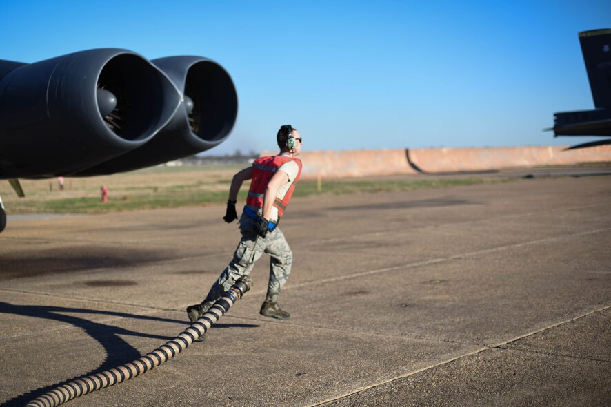 Airman 1st Class Terell Holmstrom, 2nd Aircraft Maintenance Squadron crew chief, retrieves the air cart’s nozzle at Barksdale Air Force Base, La., Jan. 30, 2017. The air cart provides air to the B-52 Stratofortress to start the engines and cool the cockpit. (U.S. Air Force photo/Airman 1st Class Stuart Bright)