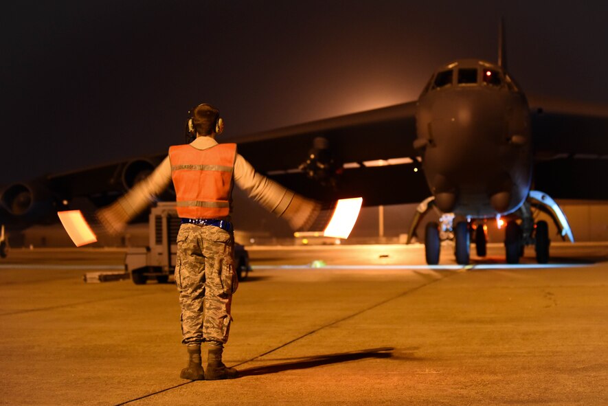 Airman 1st Class Austin Buresh, 2nd Aircraft Maintenance Squadron crew chief, marshals a B-52 Stratofortress at Barksdale Air Force Base, La., Jan. 31, 2017. The B-52 will be cleaned, have its oil serviced and checked for foreign object damage. (U.S. Air Force photo/Airman 1st Class Stuart Bright)