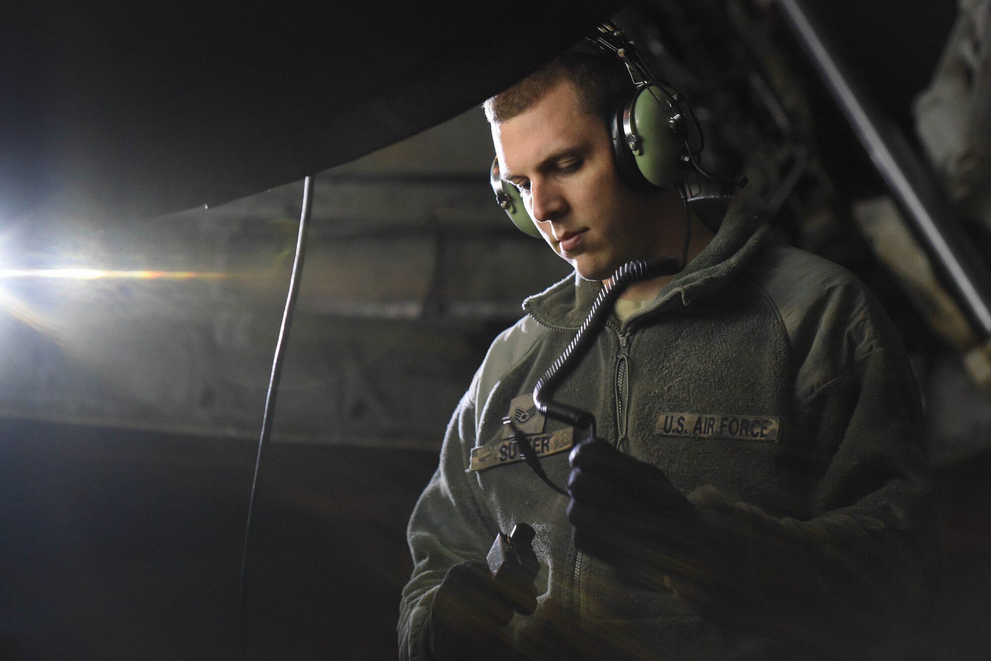 Staff Sgt. Kaleb Sutter, 2nd Aircraft Maintenance Squadron crew chief, sets up his headset after a B-52 Stratofortress taxied in at Barksdale Air Force Base, La., Jan. 31, 2017. The headset allows crew chiefs to speak with aircrew inside the jet and provides hearing protection from the engines. (U.S. Air Force photo/Airman 1st Class Stuart Bright)