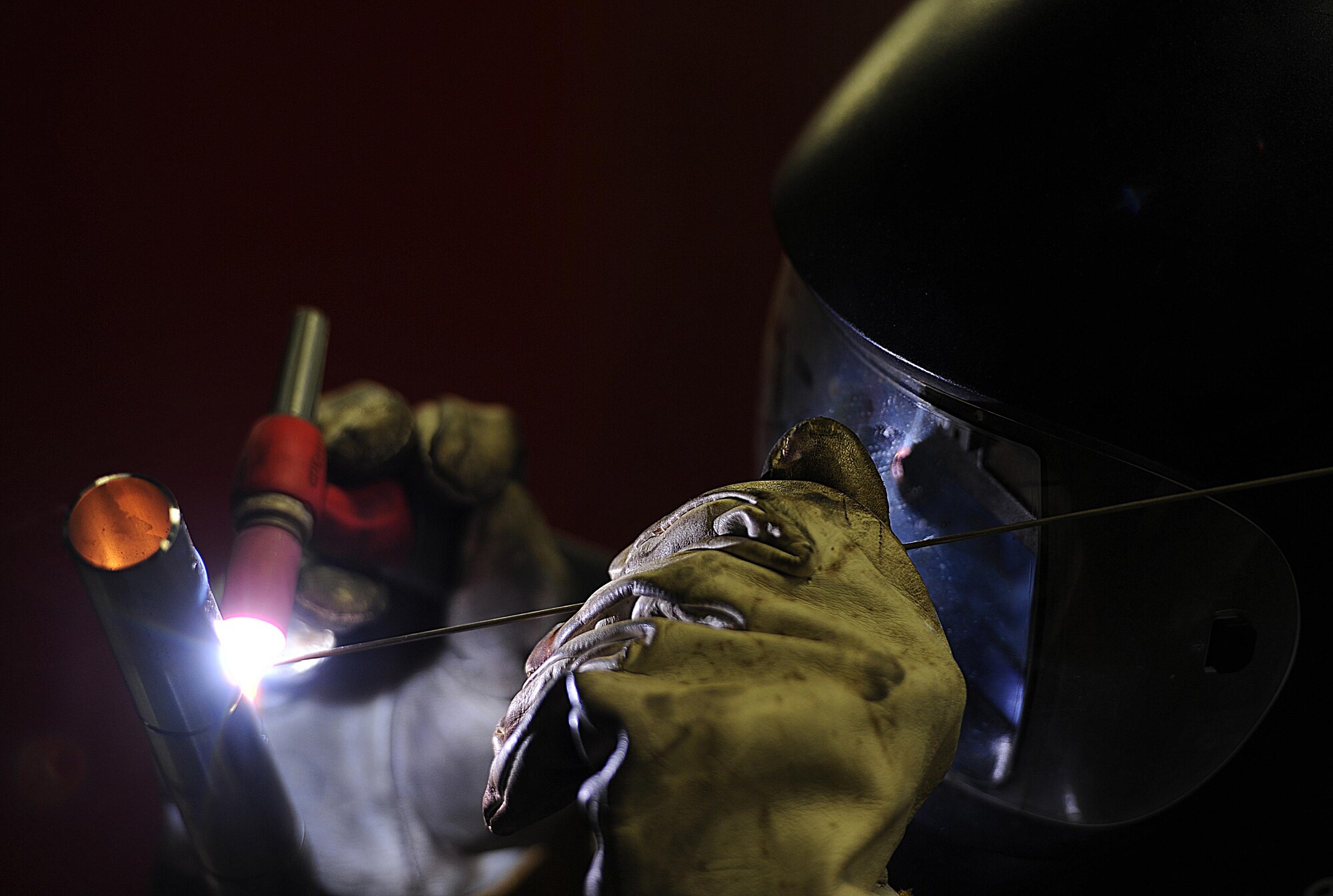 Airman 1st Class Devin Painter, 5th Maintenance Squadron aircraft metals technician, welds a piece of titanium at Minot Air Force Base, N.D., 24 Jan., 2017. Aircraft metals technicians weld, fabricate and custom-make metal components critical to the functioning of the aircrafts. (U.S. Air Force photo/Senior Airman Kristoffer Kaubisch)