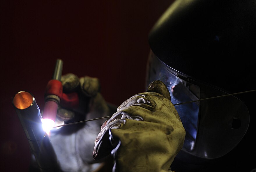 Airman 1st Class Devin Painter, 5th Maintenance Squadron aircraft metals technician, welds a piece of titanium at Minot Air Force Base, N.D., 24 Jan., 2017. Aircraft metals technicians weld, fabricate and custom-make metal components critical to the functioning of the aircrafts. (U.S. Air Force photo/Senior Airman Kristoffer Kaubisch)