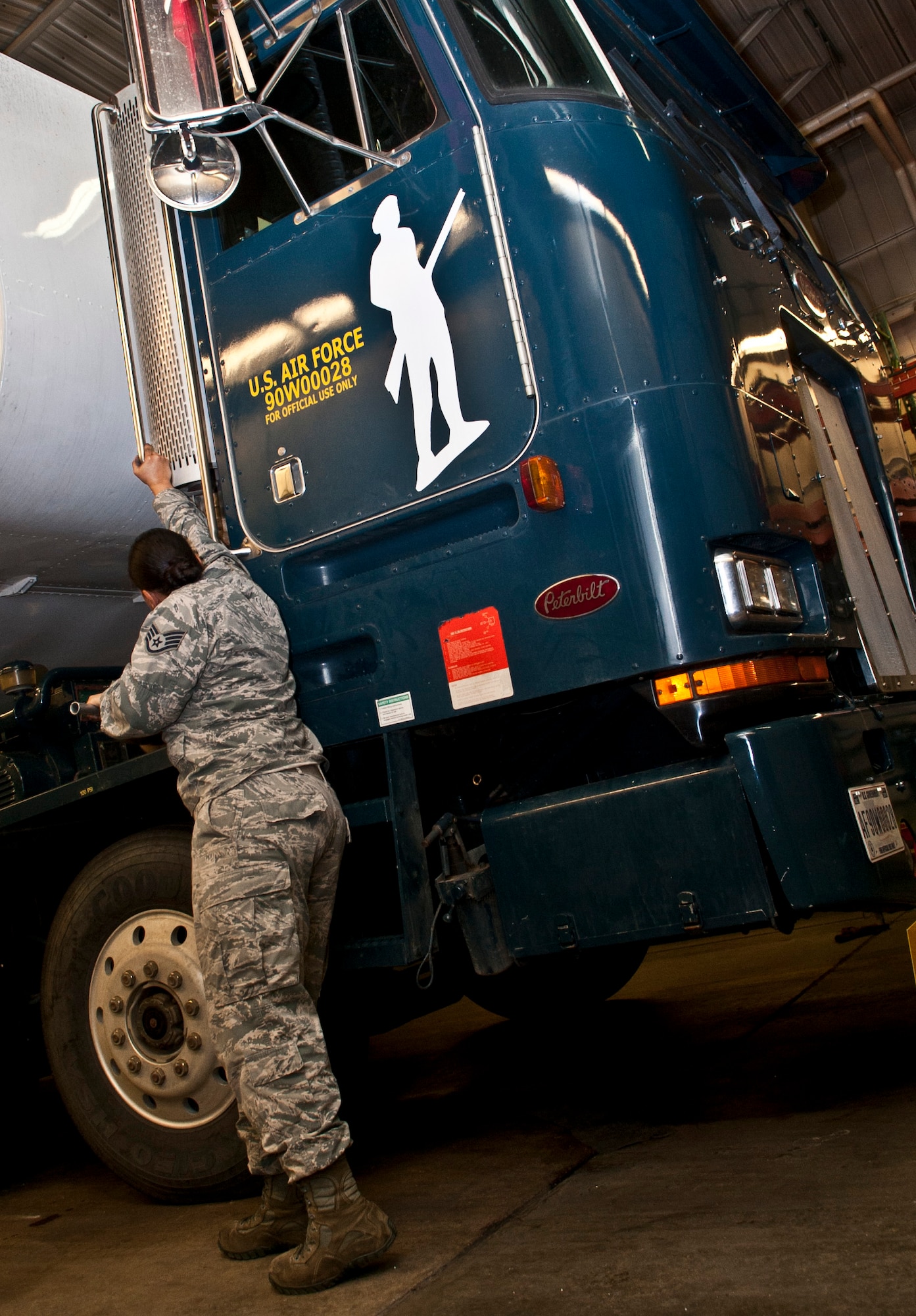 Staff Sgt. Jhalann Carey, 91st Missile Maintenance Squadron missile handling team chief, aligns exhaust stacks at Minot Air Force Base, N.D., Jan. 19, 2017. The MHT requires a four-person unit to fully inspect a transporter erector prior to using it for operations at controlled area sites. (U.S. Air Force photo/Airman 1st Class Jonathan McElderry)