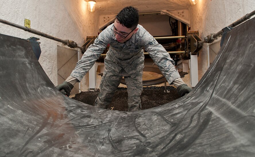 Airman 1st Class Antonio Torres, 91st Missile Maintenance Squadron missile handling team technician, inspects a third-stage carriage for serviceability at Minot Air Force Base, N.D., Jan. 19, 2017. The carriages inside the transporter erector must be inspected for both serviceability and any general damage. (U.S. Air Force photo/Airman 1st Class Jonathan McElderry)