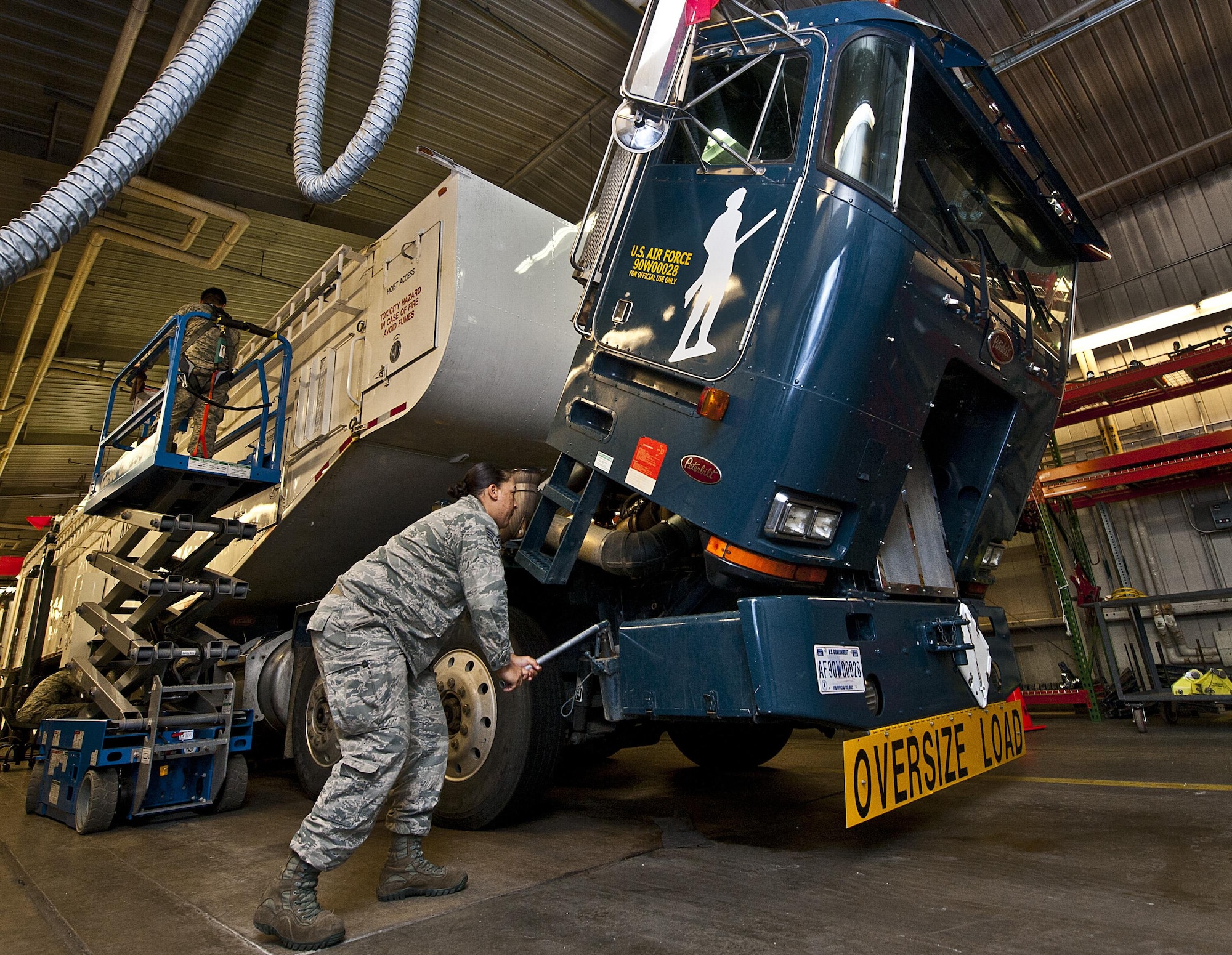 Airmen with the 91st Missile Maintenance Squadron missile handling team check the serviceability of a transporter erector at Minot Air Force Base, N.D., Jan. 19, 2017. When the MHT is at a launch facility, they are directly involved in the installation or removal of the missile's rocket fuel booster stages. (U.S. Air Force photo/Airman 1st Class Jonathan McElderry)