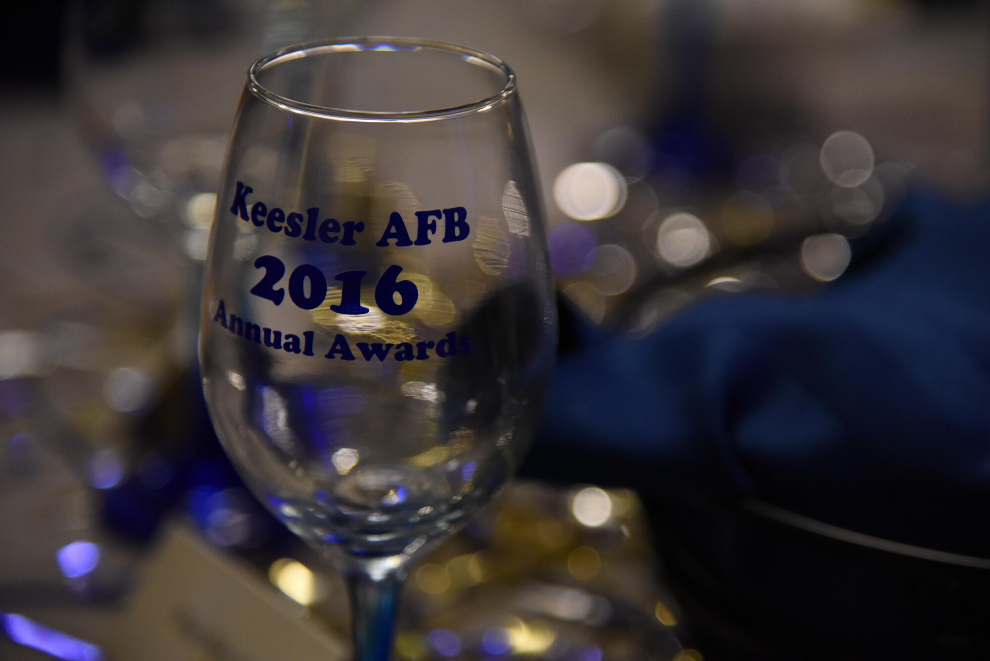 A glass sits on display during the 2016 Keesler Annual Awards Ceremony at the Bay Breeze Event Center Jan. 31, 2017, on Keesler Air Force Base, Miss. During the ceremony base leadership recognized outstanding Airmen and civilians from across the installation for their accomplishments throughout 2016. (U.S. Air Force photo by Kemberly Groue)