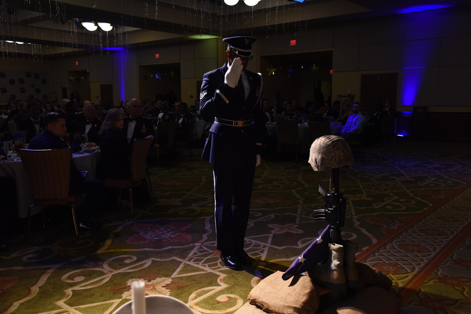 Staff Sgt. Michael Williams, Keesler Air Force Base Honor Guard member, renders a salute during a fallen warrior memorial tribute during the 2016 Keesler Annual Awards Ceremony at the Bay Breeze Event Center Jan. 31, 2017, on Keesler AFB, Miss. During the ceremony base leadership recognized outstanding Airmen and civilians from across the installation for their accomplishments throughout 2016. (U.S. Air Force photo by Kemberly Groue)
