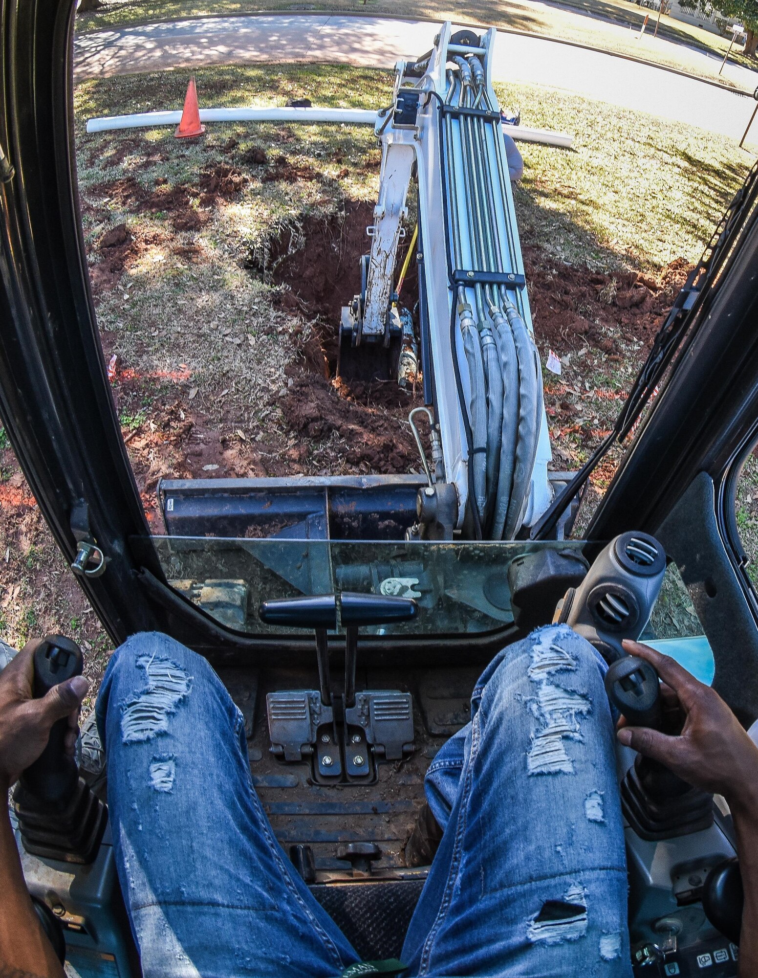 Senior Airman Samuel Parker, left, and Airman 1st Class Ashmiru Sallu-Sam, 2nd Civil Engineer Squadron water and fuel systems Airmen, install a new pipe in the main water line system at Barksdale Air Force Base, La., Jan. 31, 2017. The water line was damaged while contractors were laying fiber optic cable. (U.S. Air Force photo/Senior Airman Luke Hill)