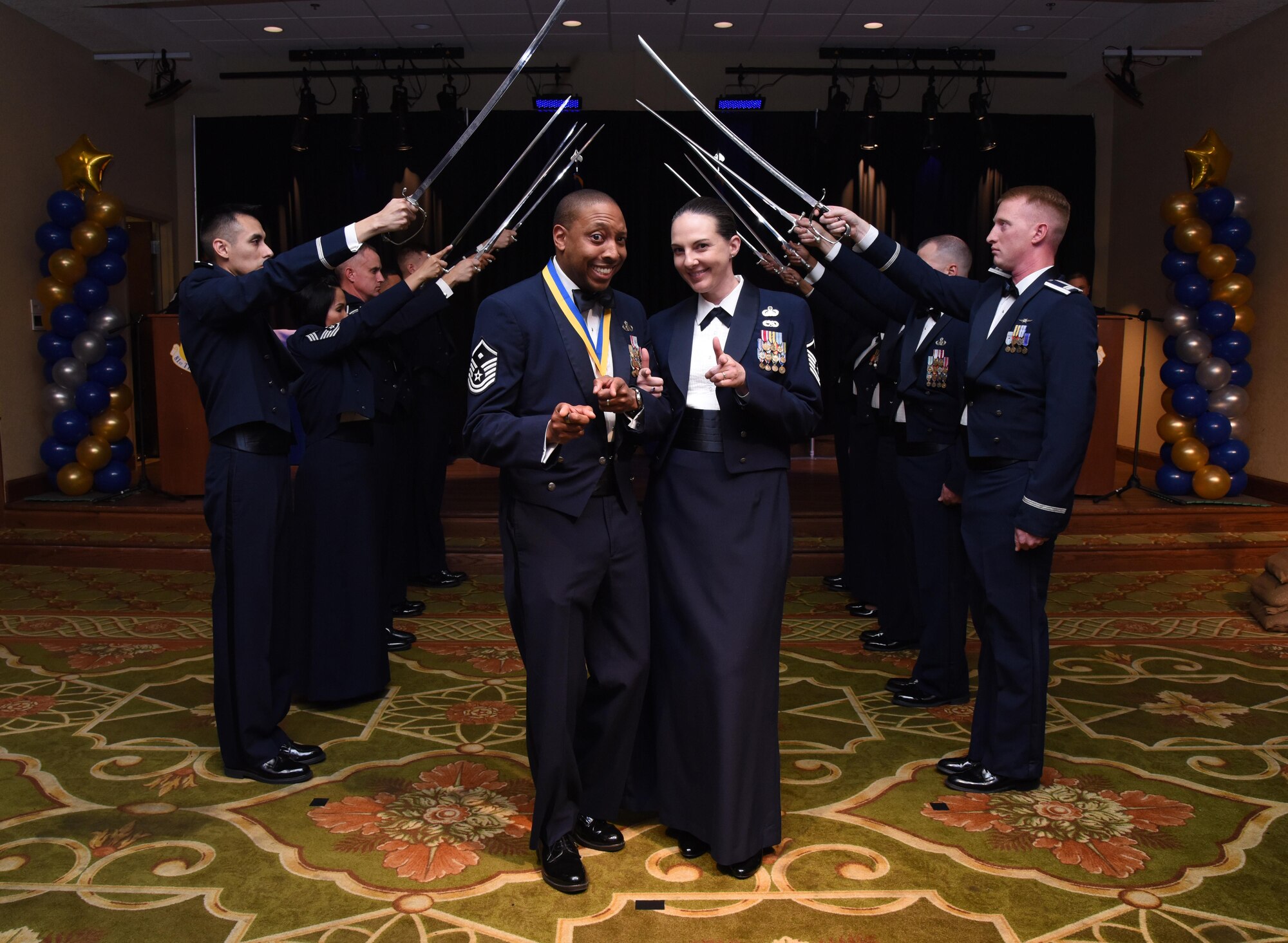 Master Sgts. Linford Smith, 81st Surgical Operations Squadron first sergeant, and his wife, Erika Stoyko, 81st Training Wing protocol NCO in charge, pose for a photo during the 2016 Keesler Annual Awards Ceremony at the Bay Breeze Event Center Jan. 31, 2017, on Keesler Air Force Base, Miss. During the ceremony base leadership recognized outstanding Airmen and civilians from across the installation for their accomplishments throughout 2016. (U.S. Air Force photo by Kemberly Groue)