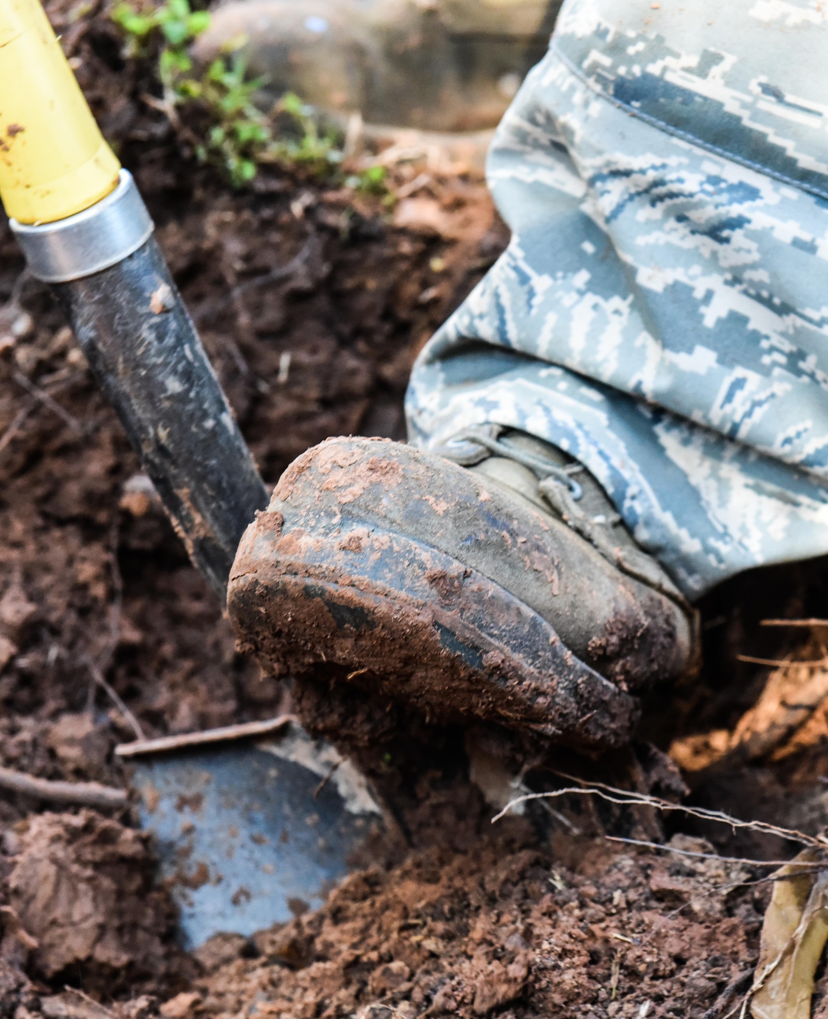 Senior Airman Samuel Parker, left, and Airman 1st Class Ashmiru Sallu-Sam, 2nd Civil Engineer Squadron water and fuel systems Airmen, install a new pipe in the main water line system at Barksdale Air Force Base, La., Jan. 31, 2017. The water line was damaged while contractors were laying fiber optic cable. (U.S. Air Force photo/Senior Airman Luke Hill)