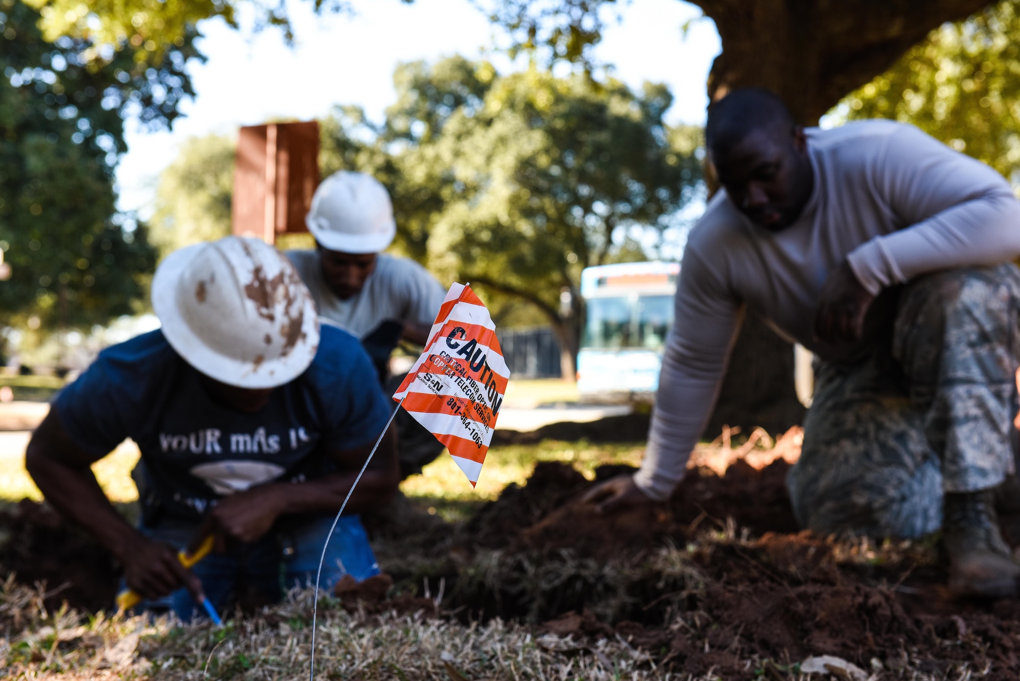 Senior Airman Samuel Parker, left, and Airman 1st Class Ashmiru Sallu-Sam, 2nd Civil Engineer Squadron water and fuel systems Airmen, install a new pipe in the main water line system at Barksdale Air Force Base, La., Jan. 31, 2017. The water line was damaged while contractors were laying fiber optic cable. (U.S. Air Force photo/Senior Airman Luke Hill)