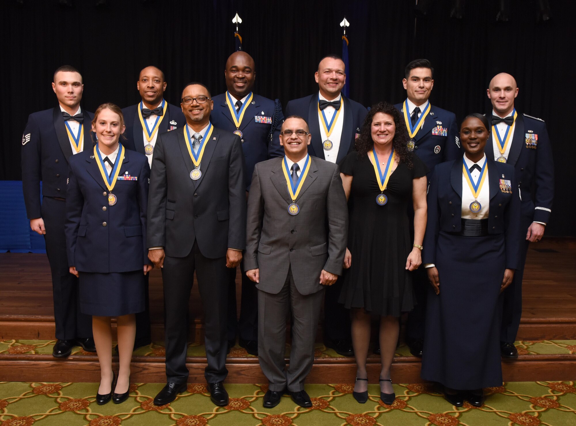 Annual award winners pose for a group photo during the 2016 Keesler Annual Awards Ceremony at the Bay Breeze Event Center Jan. 31, 2017, on Keesler Air Force Base, Miss. During the ceremony base leadership recognized outstanding Airmen and civilians from across the installation for their accomplishments throughout 2016. (U.S. Air Force photo by Kemberly Groue)