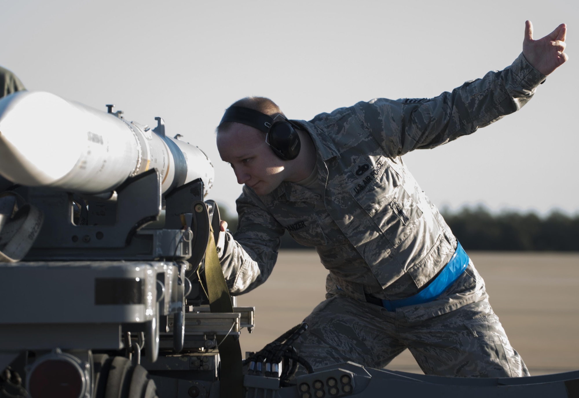 U.S. Air Force Staff Sgt. David Panzer, 33rd Aircraft Maintenance Squadron weapons load crew chief, secures a live AIM-120 advanced medium-range air-to-air missiles (AMRAAM)  onto a weapons jammer before loading it into an F-35A January 31, 2017, at Eglin Air Force Base, Florida. The 33rd Fighter Wing loaded and shot the first air-to-air missiles from an F-35A during a weapons system evaluation that took place at Tyndall Air Force Base later the same day. Carrying air-to-air missiles makes the F-35 a more versatile option for combatant commanders by securing the aircrafts survivability, in turn increasing likeliness of mission success.  (U.S. Air Force photo by Staff Sgt. Peter Thompson)