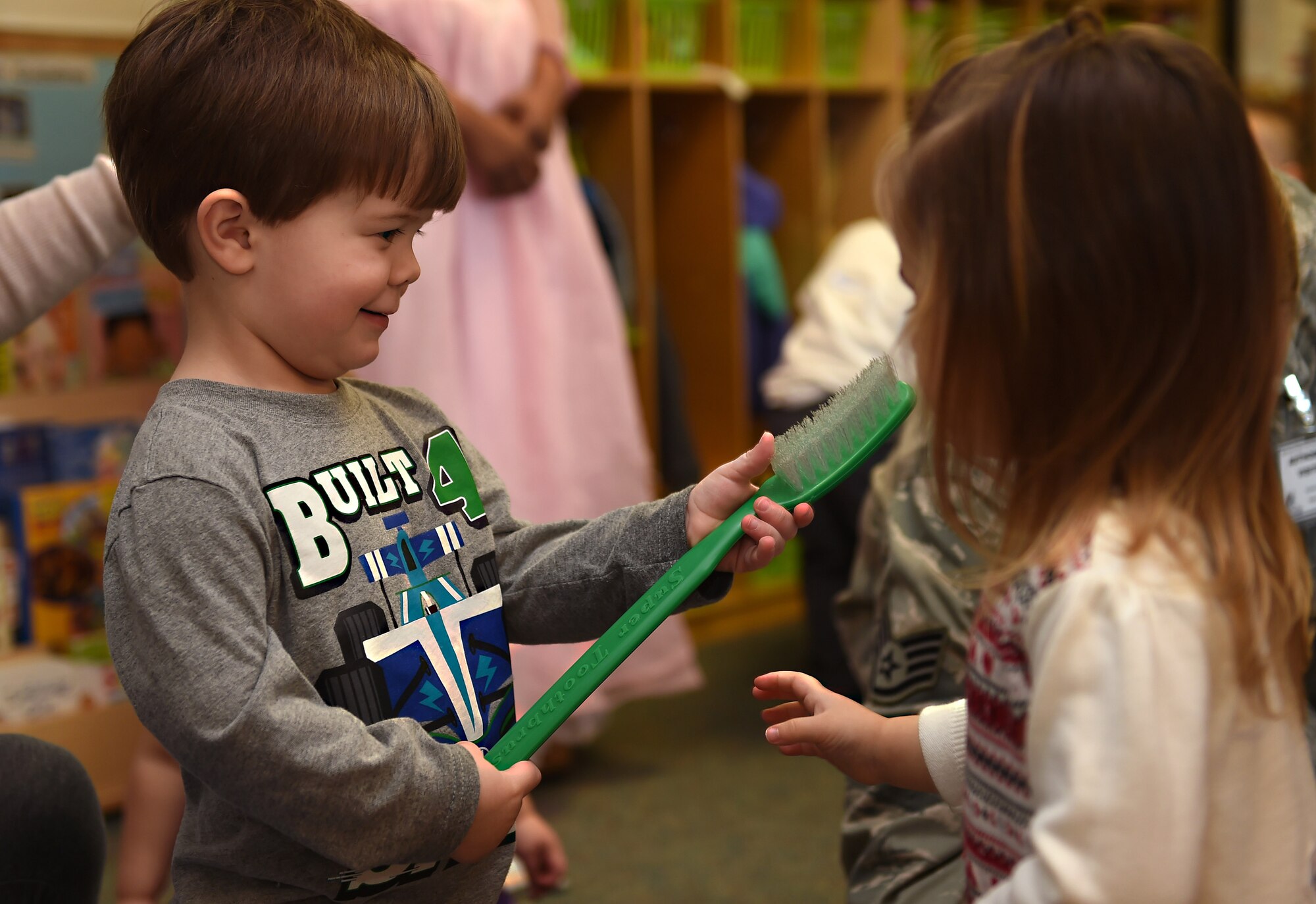 Children at the McChord Child Development Center learn about the importance of dental care as part of National Children’s Dental Health Month Feb. 1, 2017, at Joint Base Lewis-McChord, Wash. JBLM dental staffs traveled to JBLM CDCs and schools to educate youth on oral hygiene techniques, proper diet and more. (U.S. Air Force photo/Staff Sgt. Naomi Shipley) 