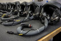 Aircrew helmets are lined up on a table waiting for use at the 374th Operations Support Squadron Aircrew Flight Equipment Flight shop Jan. 20, 2017 at Yokota Air Base, Japan. The AFE flight regularly inspects, maintains, and assembles all life-support and survival equipment used by aircrew and passengers to ensure everything is ready for use. (U.S. Air Force photo by Airman 1st Class Donald Hudson)