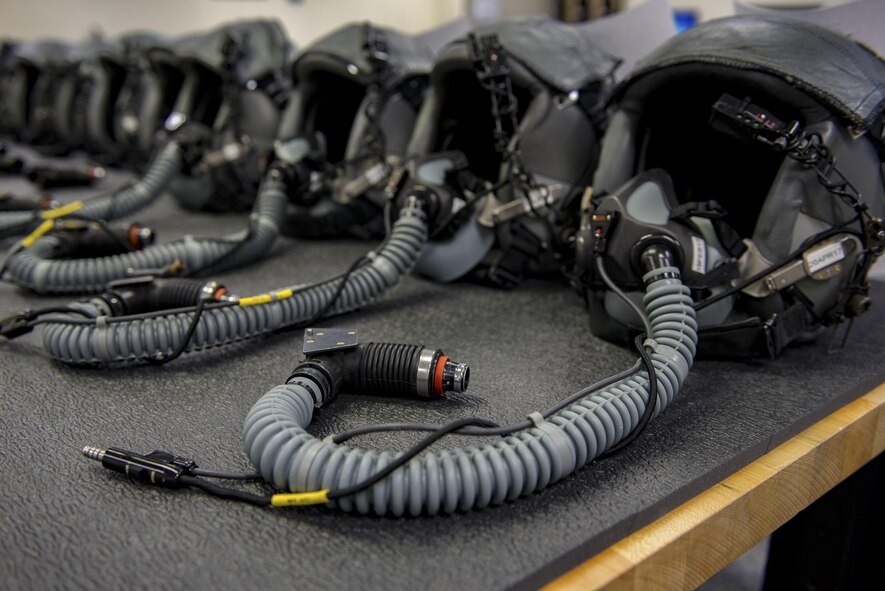Aircrew helmets are lined up on a table waiting for use at the 374th Operations Support Squadron Aircrew Flight Equipment Flight shop Jan. 20, 2017 at Yokota Air Base, Japan. The AFE flight regularly inspects, maintains, and assembles all life-support and survival equipment used by aircrew and passengers to ensure everything is ready for use. (U.S. Air Force photo by Airman 1st Class Donald Hudson)