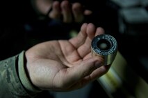 Staff Sgt. William H. Chapmon, 374th Operations Support Squadron Aircrew Flight Equipment Flight NCO in charge of chemical defense, holds a night vision goggle component Jan. 20, 2017 at Yokota Air Base, Japan. The AFE flight maintains various pieces of aircrew enhancement equipment such as night vision goggles. (U.S. Air Force photo by Airman 1st Class Donald Hudson)