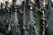 Parachutes wait to be inspected and repacked at the 374th Operations Support Squadron Aircrew Flight Equipment Flight back shop Jan. 31, 2017 at Yokota Air Base, Japan. The AFE flight is responsible for the repair, packing, and all-around maintenance of parachutes used by aircrew and survival, evasion, resistance and escape specialists. (U.S. Air Force photo by Airman 1st Class Donald Hudson)