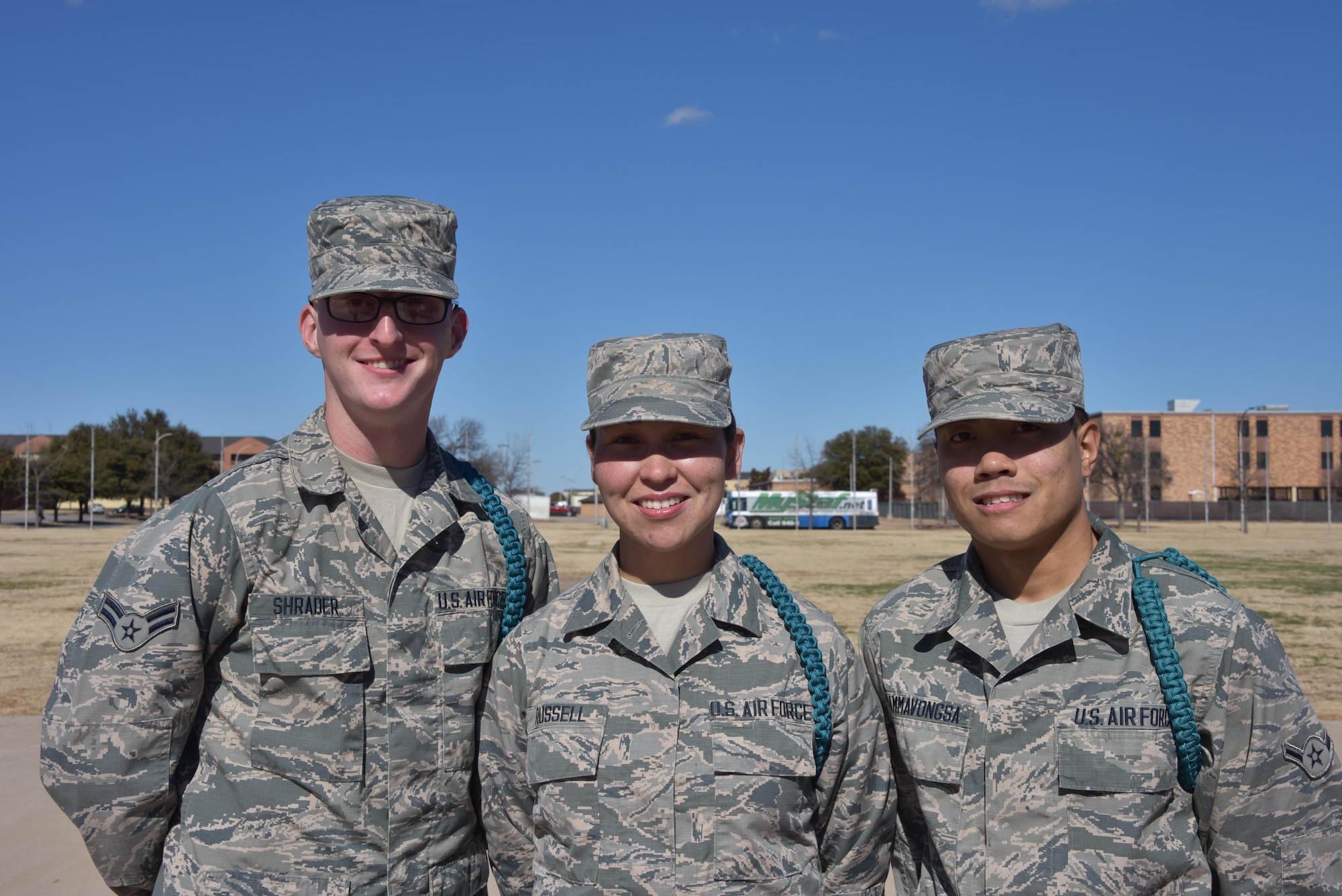 (From left to right) Airman 1st Class Kevin Schrader, Airman Carol Russell, and Airman 1st Class Richie Thammavonsa, noted as stand-out Airmen leaders, Teal Ropes,and Peer-to-Peer participants pose for a group photo at Sheppard Air Force Base, Texas. Every other Saturday these Airmen attend Peer-to-Peer to better develop themselves and those around them. “We come to learn ways to positively influence people,” said Russell, an F-15 avionics student and mother of two. “Then we go out and practice it among our peers, and they pick up on it. Then they practice it among their peers. As a whole, when we go to our different assignments, we get to continue this wherever we go.” (U.S. AIr Force photo by 2nd Lt. Brittany Curry)