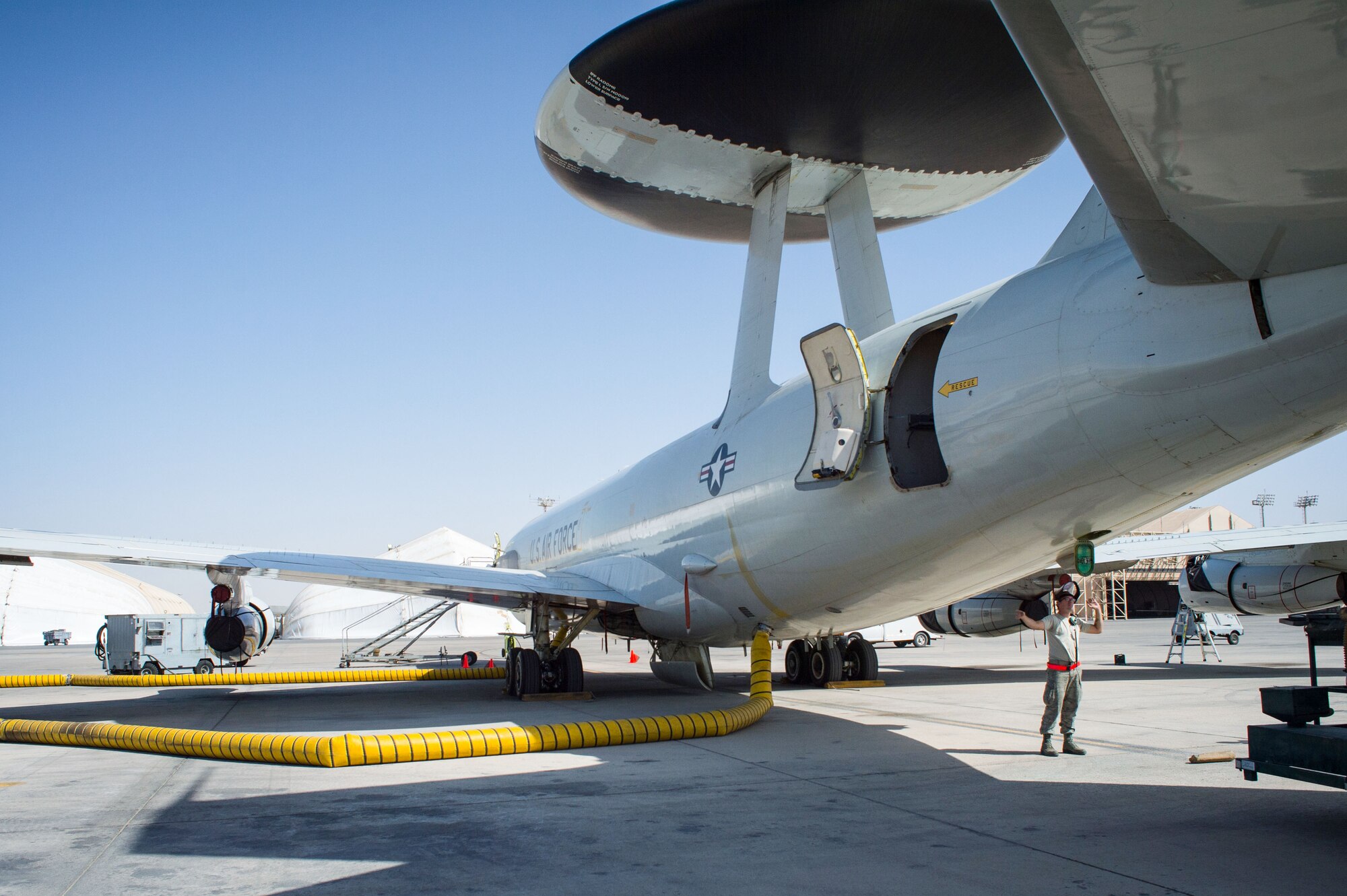 380th Expeditionary Aircraft Maintenance Squadron Airmen complete post-flight inspections on an E-3 Sentry at an undisclosed location in Southwest Asia, Feb. 2, 2017. To date, the E-3 Sentry has completed more than 10,000 hours of flight time in support of Combined Joint Task Force-Operation Inherent Resolve. (U.S. Air Force photo by Senior Airman Tyler Woodward)