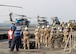 The 379th Expeditionary Medical Operations Squadron mobile field surgical and critical care teams embark on the HMS Ocean via a U.S. Navy SH-60 Sea Hawk helicpoter, Jan. 23, 2017. The MFST-ECCT medical personnel participated in exercise Azraq Serpent, where they joined coalition forces to simulate setting up a role two surgical and critical care facility on a maritime platform. (Courtesy photo, Royal Navy)