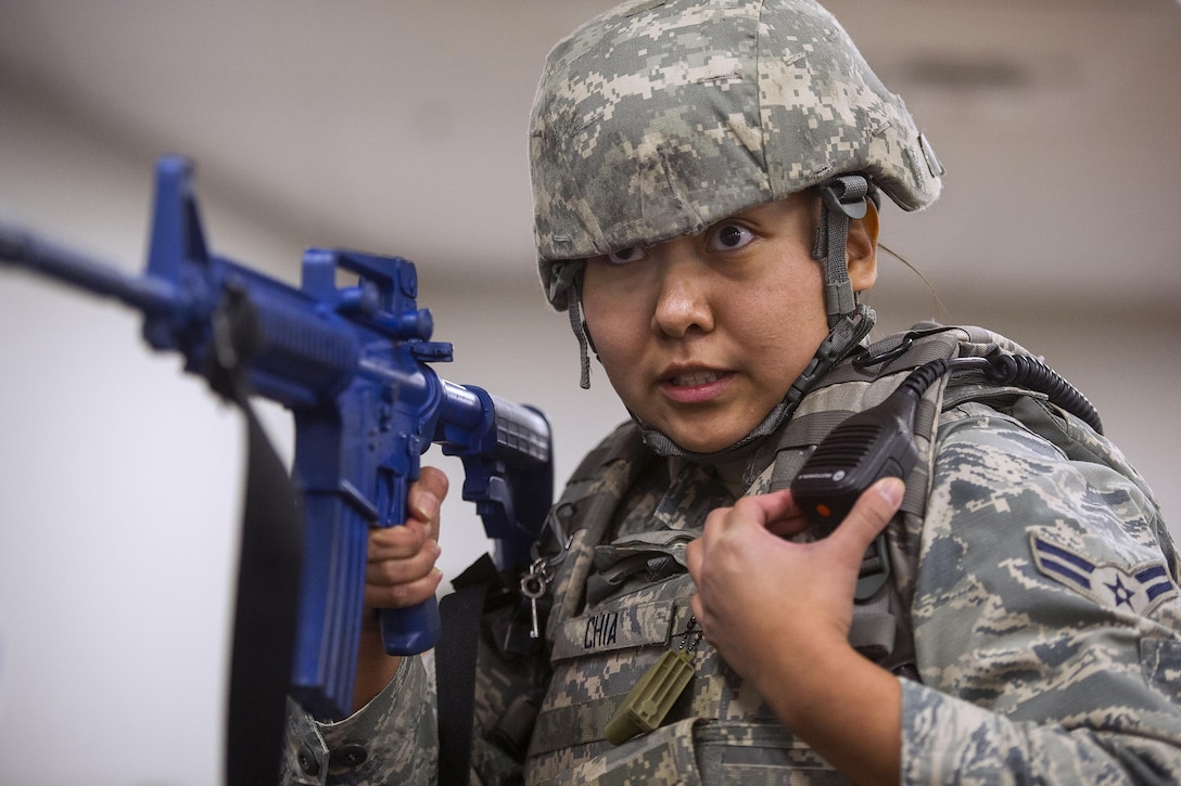 Airman 1st Class Valeri Chia reports her status during an active-shooter exercise at Wright-Patterson Air Force Base, Ohio, Jan. 30, 2017. The exercise was part of routine training to help provide a safe and secure environment on the base. Chia is a patrolman assigned to the 88th Security Forces Squadron. Air Force photo by R.J. Oriez