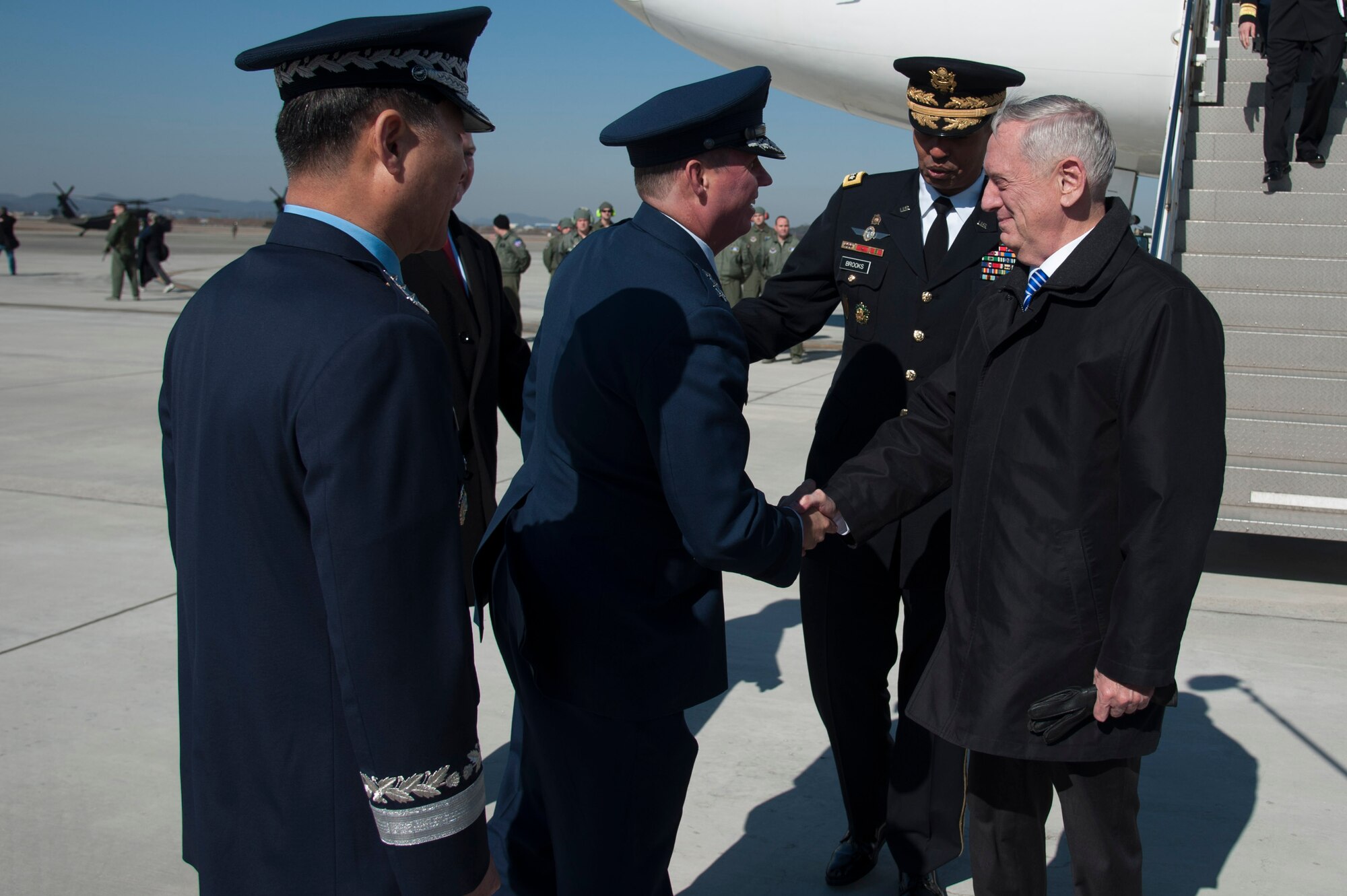 Defense Secretary Jim Mattis greets U.S. Air Force Lt. Gen. Thomas W. Bergeson, 7th Air Force commander, as he arrives at Osan Air Base, Republic of Korea, Feb. 2, 2017. The importance of the Asia-Pacific region was a vital message of Mattis’ visit, where he demonstrated the U.S.’s desire to find even deeper common ground with allies to further enhance collaboration and cooperation in the region. (U.S. Air Force photo by Staff Sgt. Jonathan Steffen)
