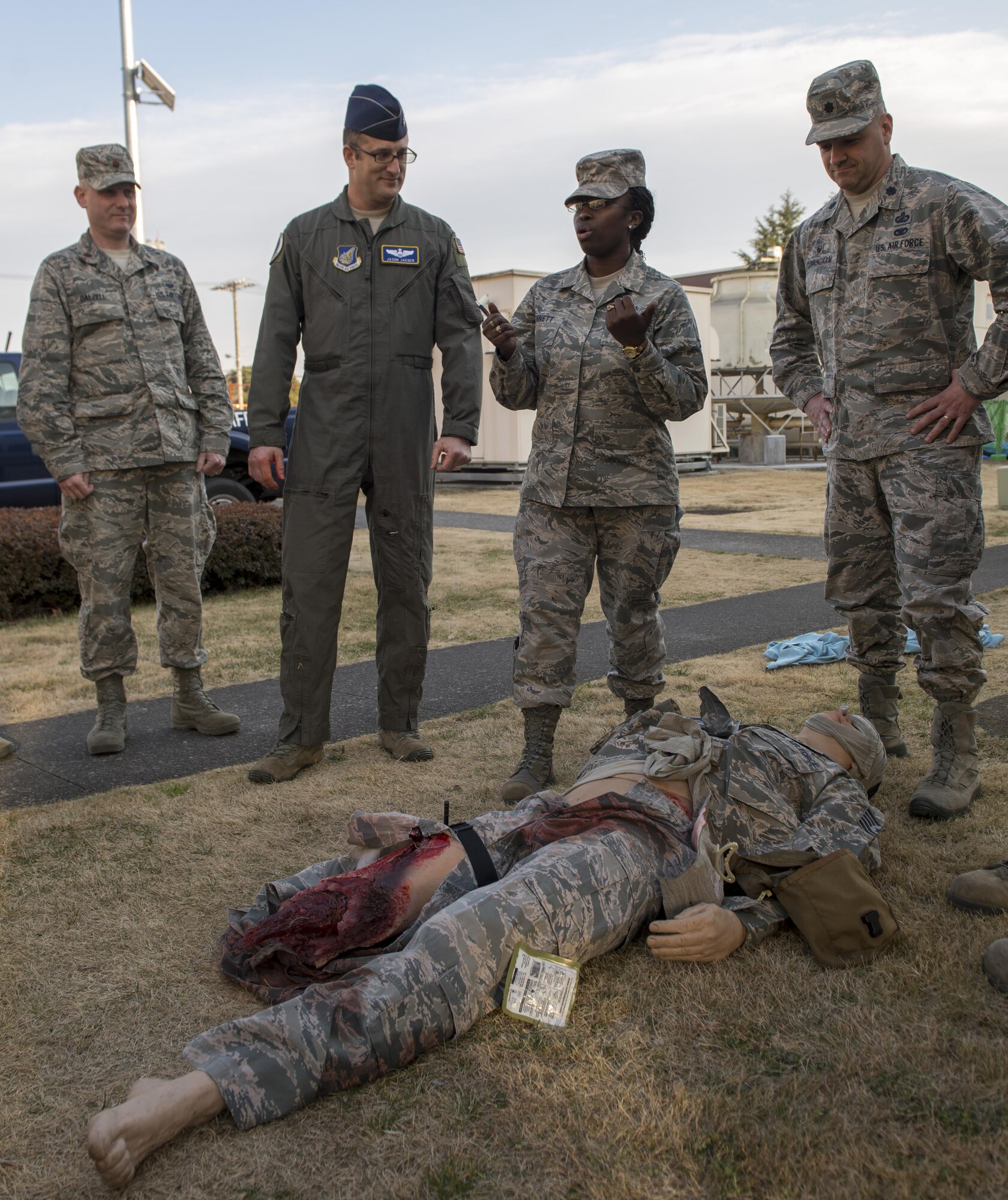 Tech. Sgt. Yolanda Bennett. 374th Aerospace Medical Squadron readiness NCO in charge, instructs members of the 374th Airlift Wing during a hands on Self Aid and Buddy Care training exercise Feb. 1, 2017, at Yokota Air Base, Japan. Bennett instructs SABC techniques with the help of MATT, a multiple amputation trauma trainer. (U.S. Air Force photo by Airman 1st Class Juan Torres)