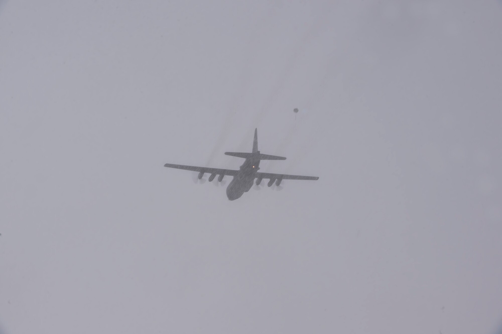 A C-130 Hercules assigned to the 36th Airlift Squadron, Yokota Air Base, Japan, drops a standard training bundle on Draughon Range near Misawa Air Base, Japan, Jan. 31, 2017. The STB is a smaller alternative to use than a full load, while providing pilots and navigators the training they need. (U.S. Air Force photo by Tech. Sgt. Araceli Alarcon)