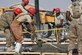 Airmen with the 557th Expeditionary RED HORSE Squadron smooth and spread concrete at Al Udeid Air Base, Qatar, during construction on the close air support ramp, Jan. 31, 2017. The 557th ERHS Airmen are laying the foundation for an aircraft maintenance workshop and administration building. (U.S. Air Force photo by Senior Airman Cynthia A. Innocenti)