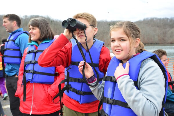 Will-Parks Murphy, son of Lt. Col. Stephen Murphy, Nashville District commander, helps his sister Claire to look for an eagle while cruising the shoreline at Dale Hollow Lake Jan. 21, 2017.  