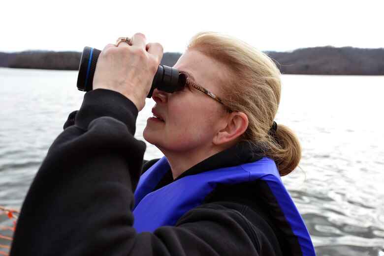 Candy Heath from Livingston, Tenn., scans the trees with binoculars for a glimpse of an eagle at Dale Hollow Lake Jan. 21, 2017.  The annual Eagle Watch tour attracts hundreds of people from Kentucky, Alabama, Tennessee and surrounding areas. 