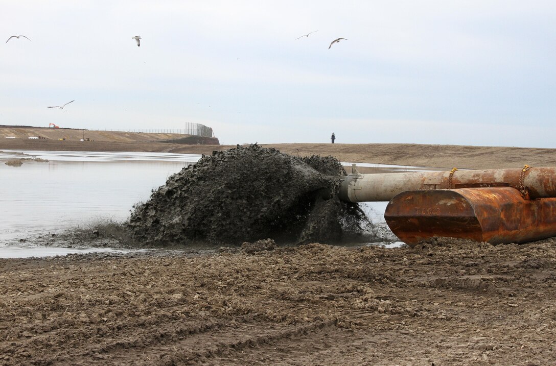 Dredged material is pumped into a containment facility located adjacent to Wilmington Harbor. The U.S. Army Corps of Engineers' Philadelphia District typically dredges the harbor every 9 to 12 months. 