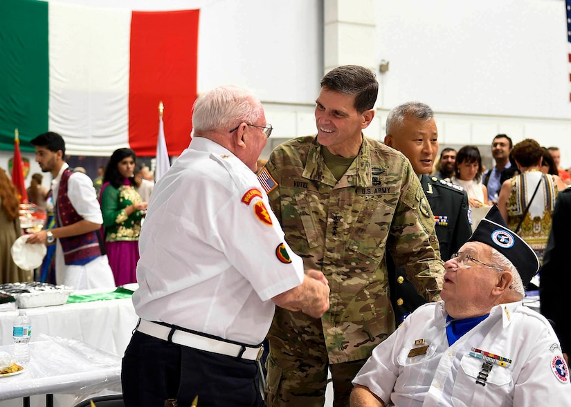 Army Gen. Joseph L. Votel, commander of U.S. Central Command, greets attendees at Coalition International Night at MacDill Air Force Base, Fla., Dec. 1, 2016. Air Force photo by Tech. Sgt. Dana Flamer