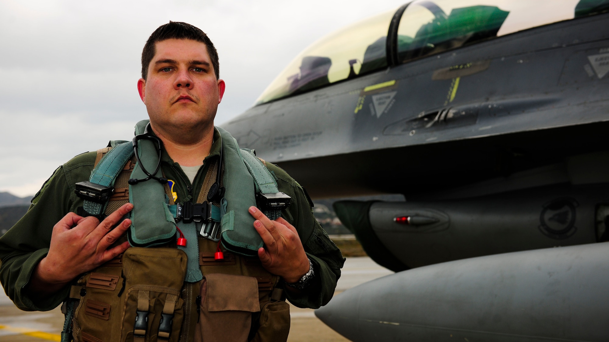U.S. Air Force Maj. Kristopher Wagner-Porter, 555th Fighter Squadron flight surgeon, ensures the deployed medical readiness of all 555th FS members. He, and his enlisted team, performs standard medical checkups, environmental surveys, deployability reviews and preventative health advisories. (U.S. Air Force photo by Austin Harvill)