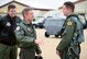 Gen. Hawk Carlisle (center), commander of Air Combat Command, and Maj. Gen. Thomas Deale, ACC A3, congratulate Capt. John "Rain" Waters, on certifying as the pilot for the 2017-18 F-16 Viper demonstration team Feb. 1, 2017 at Langley Air Force Base, Va. Demonstration pilots, who perform at air shows worldwide, serve two-year tours on their respective teams, and must be certified at multiple levels. Carlisle, as COMACC, was Waters' final level of certification, and named him as a demo pilot immediatley after the flight. (U.S. Air Force photo by Emerald Ralston)