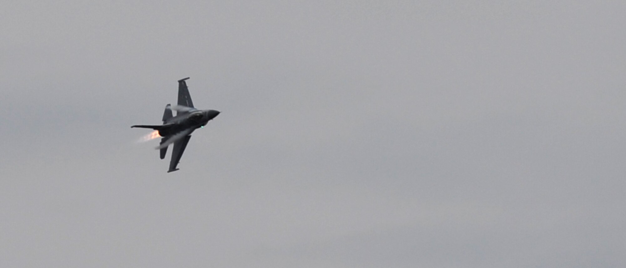 Capt. John "Rain" Waters flies his F-16 Fighting Falcon in a demonstration for Gen. Hawk Carlisle, commander of Air Combat Command, in hopes of qualifying as a pilot for the 2017-18 F-16 demonstration team Feb. 1, 2017 at Langley Air Force Base, Va. Waters performed a series of intense manuevers to demonstrate his proficiency in the F-16, and Carlisle certified him as a demo pilot upon landing. (U.S. Air Force photo by Emerald Ralston)