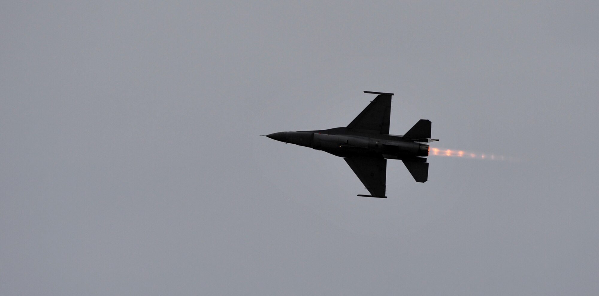 Capt. John "Rain" Waters flies his F-16 Fighting Falcon in a demonstration for Gen. Hawk Carlisle, commander of Air Combat Command, in hopes of qualifying as a pilot for the 2017-18 F-16 demonstration team Feb. 1, 2017 at Langley Air Force Base, Va. Waters endured forces up to nine times the force of gravity in the demonstration, during which he performed aerial manuevers commonly seen at air shows around the world. Carlisle certified Waters as a demo pilot immediately following the sortie. (U.S. Air Force photo by Emerald Ralston)