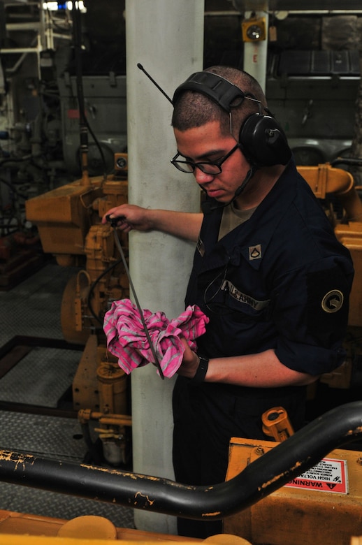 Pfc. Kenneth Sheffler, a watercraft engineer with the 411th Transportation Detachment, checks engine fluid levels of the Army Logistical Support Vessel five Maj. Gen. Charles P. Gross, during a transport mission in the Arabian Gulf 20 Jan., 2017. The crew hauled cargo to Qatar from Port of Shuaiba, Kuwait and transported another load during the return trip. While underway the crew practiced several maritime emergency exercises including man overboard, fire, and battle drills. The crew consisted of watercraft operators, engineers, cooks, and medics, although each member is trained to perform several tasks outside the scope of their duty specialty in case of an emergency situation. (U.S. Army photo by Sgt. Aaron Ellerman)