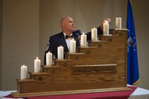Senior Master Sgt. Kevin Jenkins, 23d Maintence Group weapons standardization superintendent, lights a ceremonial candle at the Chief Induction Ceremony, Jan. 28, 2017, at Moody Air Force Base, Ga. The candles signify the climb up the rank structure. The induction ceremony is a time-honored tradition that recognizes Airmen as they make the transition from senior master sergeant to chief master sergeant. (U.S. Air Force photo by Andrea Jenkins/Released)