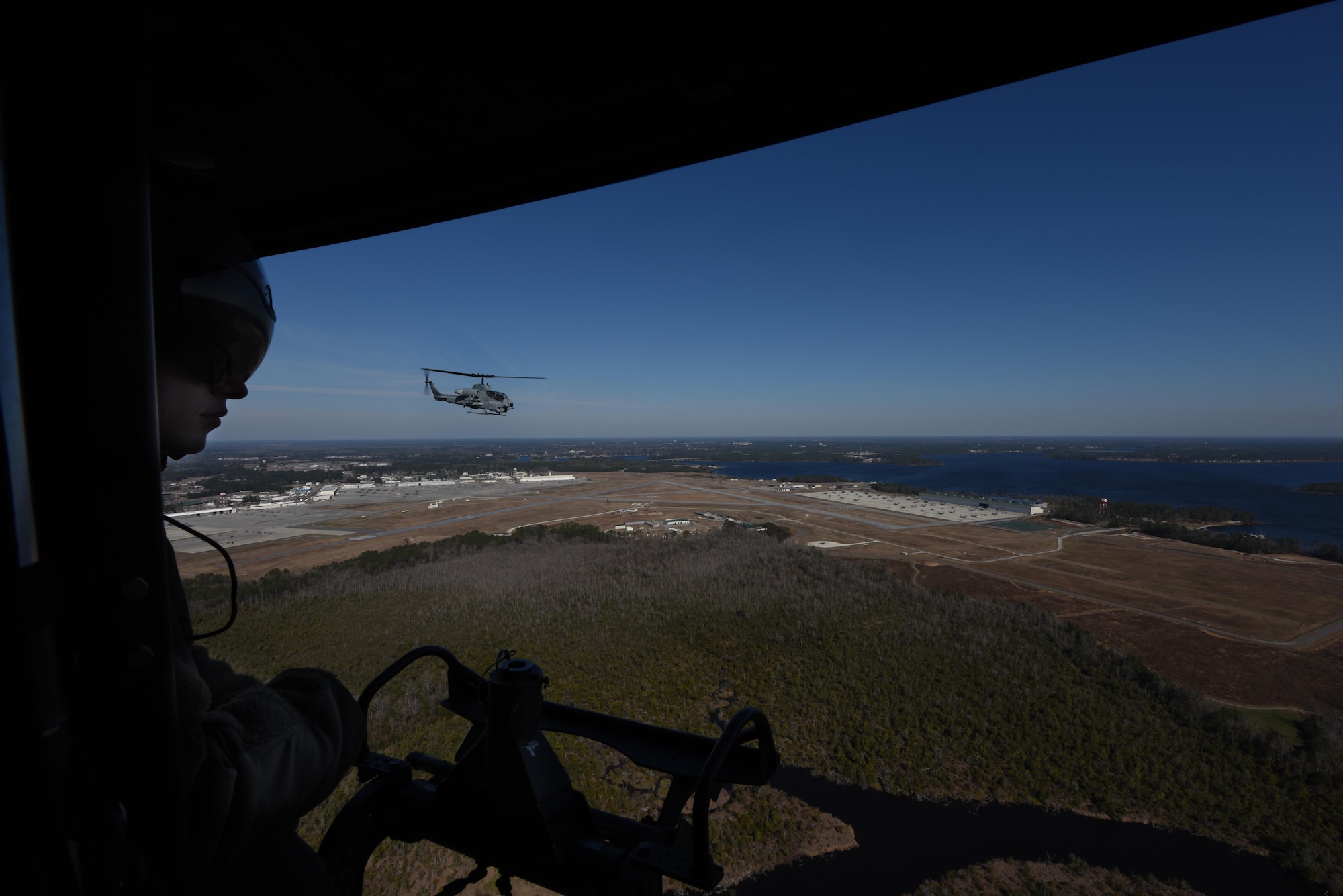 An AH-1W Super Cobra and UH-1Y Venom assigned to the Marine Light Aircraft Helicopter Squadron 269 from Marine Corps Air Station New River, in Jacksonville, North Carolina, respond to a simulated downed aircraft call during a tactical recovery of aircraft and personnel exercise, Jan. 31, 2017, in Kinston, North Carolina. The aircraft provided air support and successfully recovered the down aircrew during the exercise. (U.S. Air Force photo by Senior Airman Brittain Crolley)